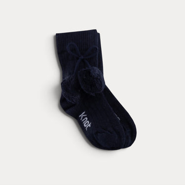 Mid-calf socks with pom-poms