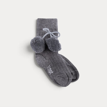 Mid-calf socks with pom-poms