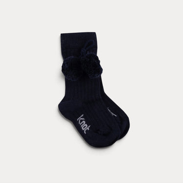 Knee-high socks with pom-poms