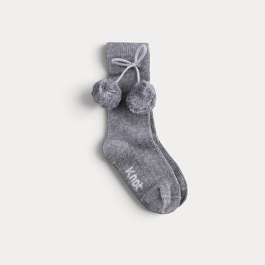 Knee-high socks with pompoms